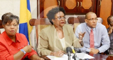 Opposition leader Mia Mottley (centre) flanked by MPs Cynthia Forde (left), Kerrie Symmonds and Trevor Prescod.