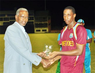 Preston Mc Sween receives his man of the match award from Grantley Culbard. 