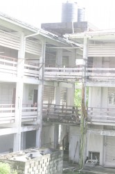 A section of the building showing the deteriorated balcony and gutter.  (Photo by Arian Browne)