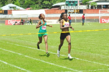 All Guyana! Guyana’s Jevina Straker and Cassie George earned a one-two finish in yesterday’s 1500m event by almost 250 metres. (Orlando Charles photo) 