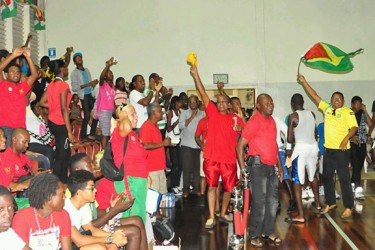 Guyana’s supporters going berserk in the stands following the female 47-29 victory. (Orlando Charles photo) 