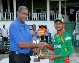 The Chairman of WI selectors Clyde Butts presents Mehedy Hasan with Man-of-the-Series prize.(Photo courtesy of West Indies Cricket photostream)