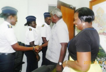 Public Works Minister Robeson Benn (second from right) congratulating one of the cadets. (MARAD photo)