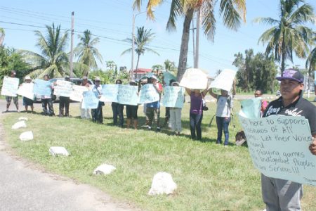 Protestors outside of the International Conference Centre lending support to their various toshaos. 