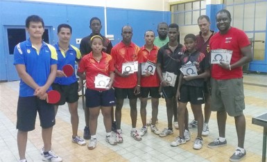 The Guyana A and B teams with Suriname Table Tennis Association president Desire Hooghart fifth from right. 