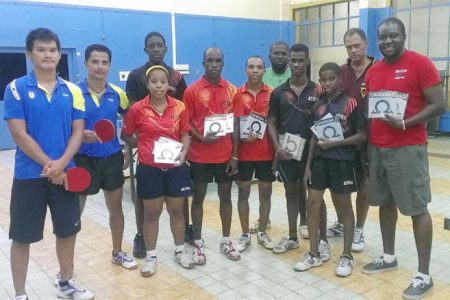 The Guyana A and B teams with Suriname Table Tennis Association president Desire Hooghart fifth from right.
