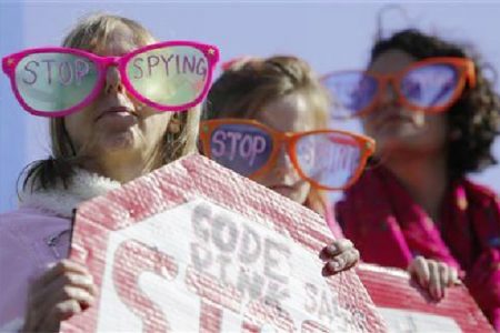 Demonstrators from the organization Code Pink wear toy glasses reading “Stop Spying” at the ‘Stop Watching Us: A Rally Against Mass Surveillance’ near the US Capitol in Washington, October 26, 2013. (Reuters/Jonathan Ernst)

