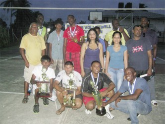 The winning PMTC 1 team posing with their trophies and medals. 