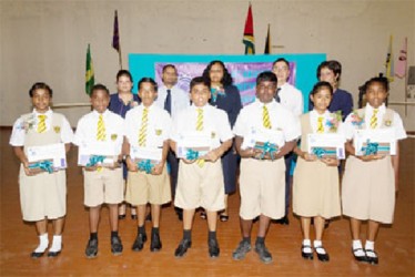 RightStart NGSA 2013 Awardees with Officers of Republic Bank (Guyana) Limited and the Principal at Queen’s College. (Republic Bank photo) 