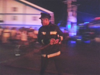 A fireman in action in Eccles during the fire last night. 