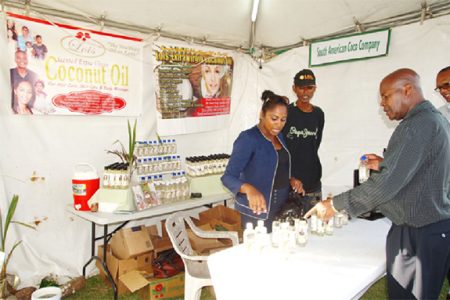Lois Rickford tending the South American Coco stall at the recently concluded Caribbean Week of Agriculture exhibition in Guyana.