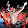 People’s National Movement (PNM) Senator Fitzgerald Hinds celebrates with party supporters last night on his arrival at Balisier House in Port of Spain.