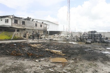 Firemen inspecting the rubble from Wednesday’s fire.  