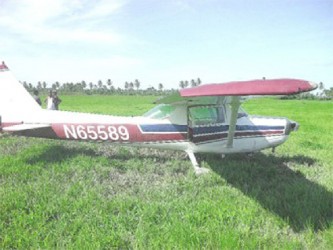 The aircraft in a rice field at Maria’s Pleasure, Wakenaam two years ago (Stabroek News file photo) 