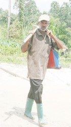 A resident of Brickery heading  home from the backdam 