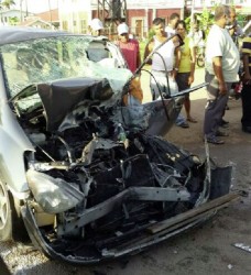 The crushed car, in which Murshid (leader) of the Guyana Islamic Trust (GIT) Haseeb Yusuf and two foreign nationals were travelling, after the collision with a truck at Skeldon, Corriverton, early yesterday morning 