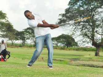 OFF YOU GO! Gregory Dean, Digicel CEO tees off to get this year’s Guyana Open golf tournament underway yesterday morning at the Lusignan Golf Club. (Orlando Charles photo> 