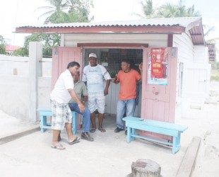 Men socializing at Rajnie’s Grocery/Beer Garden