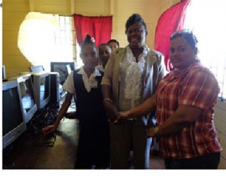 From left, Michelle Barton (Head of Gibson Primary School) and Natasha Baburam (Committees Manager for Food For The Poor) 