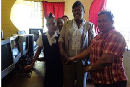 From left, Michelle Barton (Head of Gibson Primary School) and Natasha Baburam (Committees Manager for Food For The Poor)