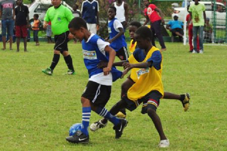 St Pius Primary School on the attack in their match against East La Penitence yesterday at the Banks DIH Thirst Park ground.