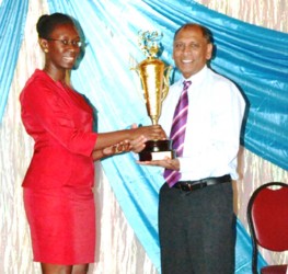 A representative of Geddes Grant receiving the award for the Best Pesticide Storage Facility in the country. (GINA photo)