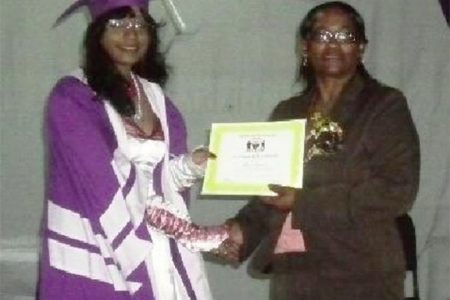 President’s College and Guyana’s top CAPE student Shalita Appadu
receiving her certificate
