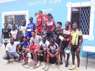 Winners and runners up pose with their spoils following the presentation ceremony of the inaugural United Bike Shop 70-mile road race.