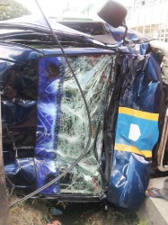 The damaged front of the minibus 