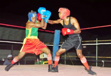 Fistic action between amateur standouts, Stephan Gouveia (right) and Clairmont Gibson. (Orlando Charles photo) 