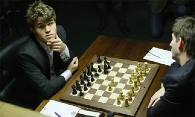 Magnus Carlsen (left) faces Alexander Grischuk in the 2013 Candidates tournament in London. Carlsen, the unstoppable force, is challenging Vishy Anand for the world chess championship title in Chennai, India. As part of a devoted training programme for the match, Carlsen plays badminton and tennis just as Fischer did as he was preparing for Spassky. Fischer preferred tennis and swimming. Carlsen has been named the number one chess player in the world on 21 consecutive rating lists. His magical ability to calculate accurately, is now legendary.  