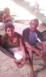 Krishna Munilall and his wife Latchmin Basmattie mourning the loss of their son. 