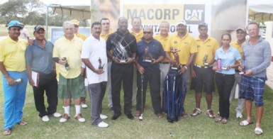 MACORP Invitational Golf tournament winner Jaipaul Suknanan (fifth from right) poses with the other winners and MACORP representatives.