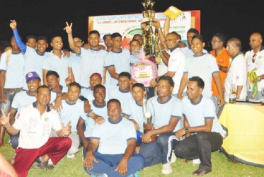 The new 2013 Open Softball Champions Trophy Stall holding their winning trophy.