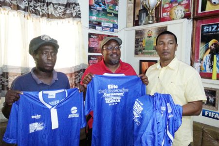 Displaying the donated uniforms from left to right are- Alpha United and National Head Coach Wayne Dover, Caledonia AIA Head Coach Jamal Shabazz and Kashif and Shanghai Co-Director Kashif Muhammad.
