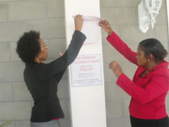 Human Services Minister Jennifer Webster and Digicel’s Head of Marketing Jacqueline James unveiling the plaque for the new Mahaica Children’s Home