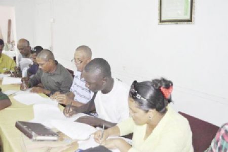 GAWU representatives signing the deal. (GAWU photo)