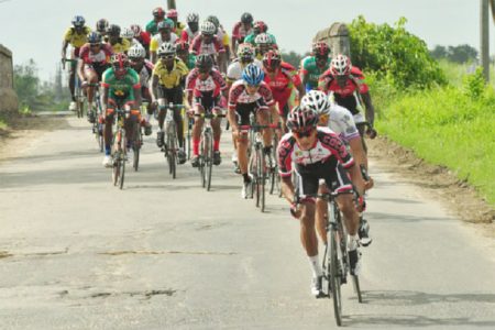 Riders going at it during yesterday’s 35-mile third stage from Wales to Parika. (Orlando Charles photo)