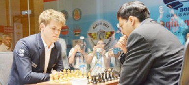 Magnus Carlsen, left and Viswanathan Ananad. (photo courtesy of FIDE website) 