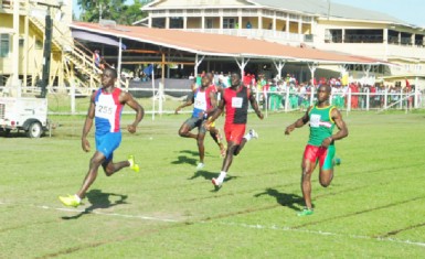 Winston George comfortably crosses the finish line to win the men’s 100m event on Friday. (Orlando Charles photo)