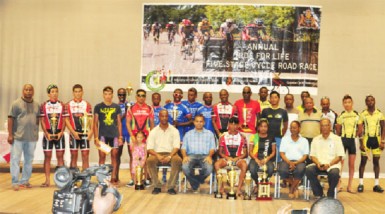  Proud Moment! Minister of Sport, Dr. Frank Anthony, second from left, sitting, shares a photo opportunity with the winners and runners up at the National Culture Centre following the conclusion of the Tour of Guyana event yesterday. (Orlando Charles photo)