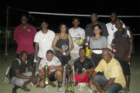 The winning PMTC 1 team with their trophies. 