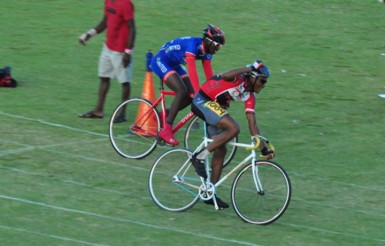 National cyclist, Michael Anthony of Linden takes the boys open 3000m cycling event ahead of District 11’s Hamzah Eastman. (Orlando Charles photo) 