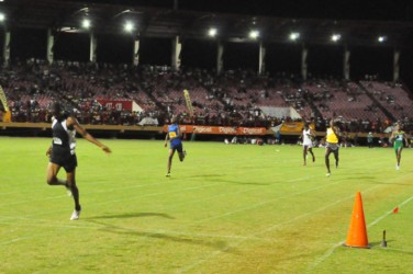 Junior sprint sensation, Jason Yaw storming to victory in record time in the Boys under-20, 400-metre event yesterday. (Orlando Charles photo)