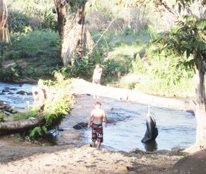 Persons at the Kumu Creek
