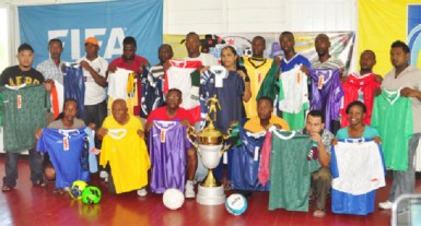 Coaches from the competing schools in the inaugural Kashif and Shanghai secondary schools football tournament display their respective team jerseys 