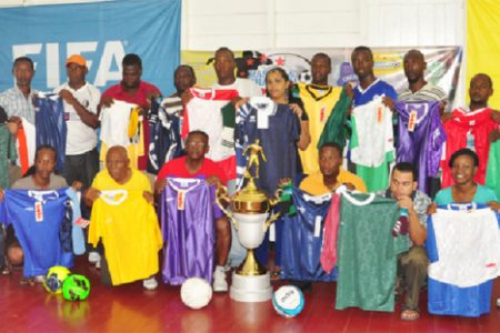 Coaches from the competing schools in the inaugural Kashif and Shanghai secondary schools football tournament display their respective team jerseys
