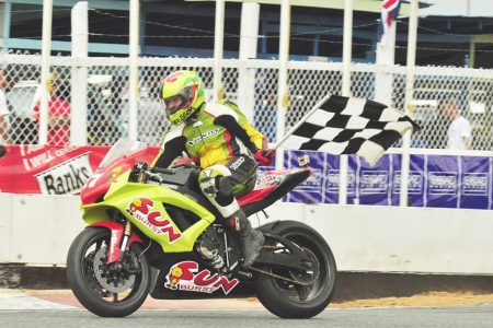 Stephen Vieira flies the checkered flag after claiming victory in the Super Bike segment of the races