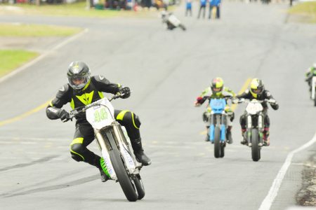 This racer prepares to negotiate a turn during the 125cc race yesterday