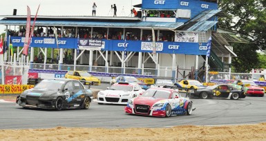 7.Mark Vieira (centre) in third before he eventually sped his way to victory after overtaking his Jamaican counterpart Doug Gore (right) and fellow Guyanese Kevin Jeffrey (front)